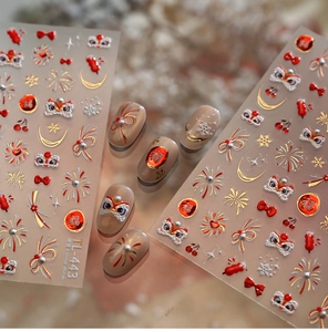 Detail of TL-443 nail stickers featuring red lion dance, fireworks and gold bow knots