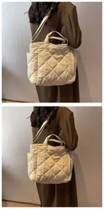 Detail of beige quilted tote bag showing classic diamond stitching and long shoulder strap