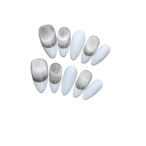 Minimalist French white almond press-on nails with silver cat-eye magnetic glitter effect