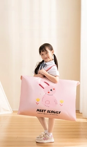 Close-up of pink waterproof storage bag for kids bedding featuring a cute rabbit pattern