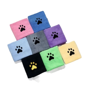 Thick coral fleece pet towels with embroidered paw prints in various vibrant colors