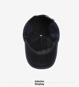 Close-up of quilted lining and ear flaps inside a warm winter baseball cap
