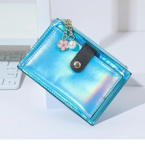Macro detail of iridescent laser PU leather card holder with floral pearl charm