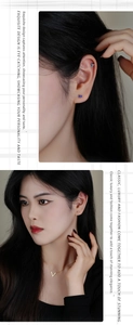 Macro detail of S925 silver triangle stud earrings and gold V necklace on model