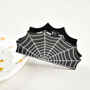 Detailed view of large black spider web hair claw clip with glossy acetate finish