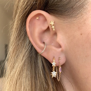 Elegant gold chain tassel earrings set with pink gemstone and zircon star studs
