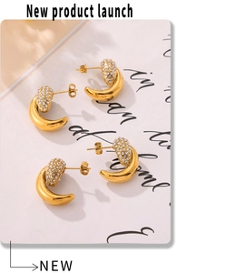 Macro view of C-shaped crescent earrings with micro-set diamonds and 18k gold plating