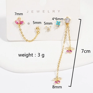 Detailed view of gold earrings set with colorful zircon stones and length measurements