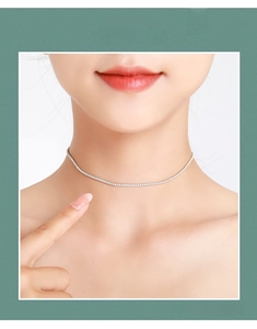 Close-up of a minimalist S925 sterling silver choker necklace with sparkling zircon pavé