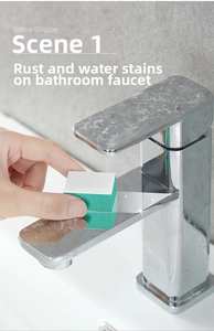 Detail of cleaning sponge removing scale and rust from a stainless steel bathroom faucet