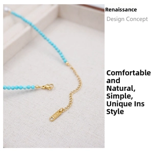 Detail of turquoise necklace with gold extender chain and K18 engraving on clasp
