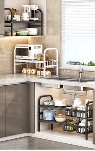 Detail of adjustable kitchen under-sink rack showing extendable shelves and baskets