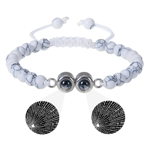 Detail of 6mm white turquoise beads and double projection stones showing I Love You