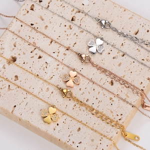 Three-color stainless steel clover necklaces with crystal inlay in gold, silver, and rose gold