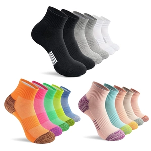 Detailed arrangement of colorful mid-calf sports socks in black, white, and grey shades