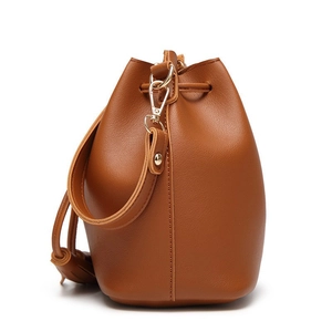 Chic brown PU leather bucket bag with drawstring closure and stylish shoulder strap detail