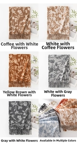 Detailed close-up of floral print scarves with fringe, multiple color options shown