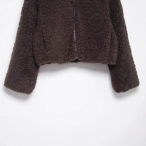 Women's warm brown teddy fleece jacket with thick texture and front zipper detail