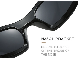 Detail of ergonomic nasal bracket on black sunglasses to relieve bridge pressure