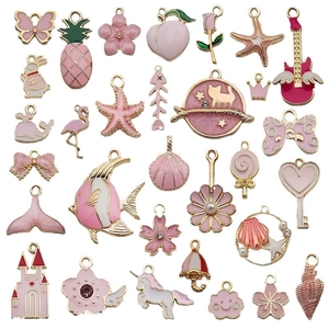 28 pink and gold enamel DIY jewelry charms featuring butterflies flowers and sea stars