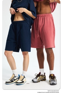 Detail of navy blue and dusty pink cotton terry shorts with drawstring elastic waist
