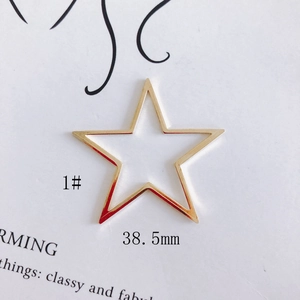 Macro detail of a 38.5mm gold hollow star pendant for DIY jewelry making accessories