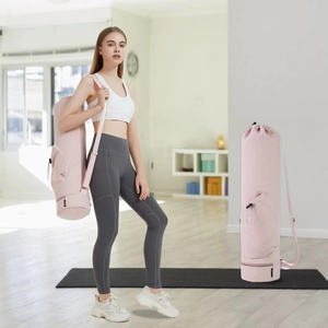 Pink yoga mat bag detail view, showing adjustable straps and side pocket for daily fitness gear.