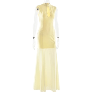 Detail of light yellow slim dress featuring teardrop cutout and sheer mesh fishtail skirt