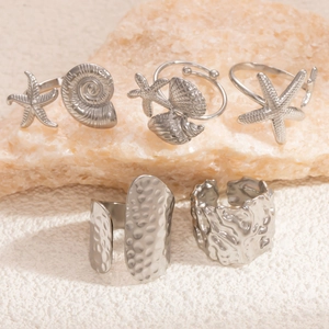 Detailed set of 5 silver stainless steel rings featuring starfish and seashell designs