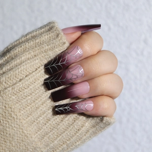 Long coffin press-on nails with purple gradient and silver spider web for Halloween