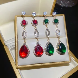 Elegant silver drop earrings with red and green gems and sparkling diamond accents