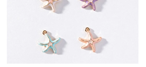 Macro view of colorful alloy starfish charms with enamel drip finish in four soft colors