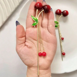 Elegant gold metal cherry hair stick with deep red fruit and long fringe tassels