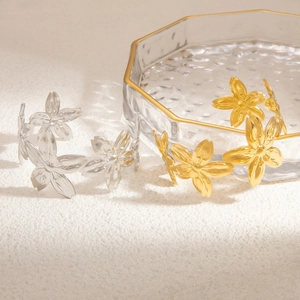 Artistic flower open bangle in gold and silver finish with elegant titanium steel design