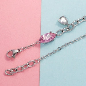 Elegant silver bracelet featuring pink marquise zirconia and a white teardrop heart pendant