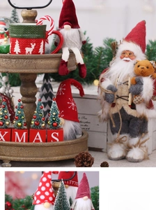 Detail of Christmas gnomes and Santa Claus figurine with XMAS wooden blocks and decor