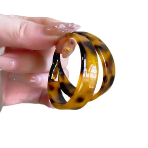 Classic tortoiseshell pattern large C-shaped hoop earrings with a high-gloss finish