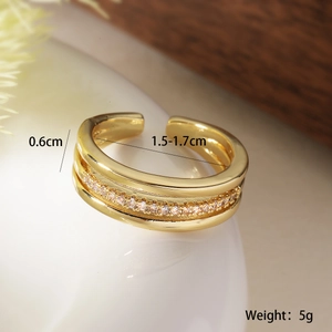 Macro shot of gold-plated geometric ring with zircon details and size measurements