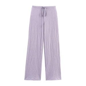Detail of light purple textured fabric wide-leg pants with elastic drawstring waist