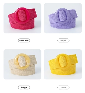 Detail of four colorful bohemian stretch straw belts with round resin buckles for women