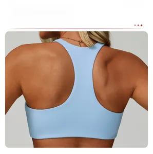 Detail view of the racerback design on a light blue high-elastic sports bra for women