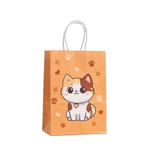 Detailed view of orange cartoon cat paper gift bags with white handles, pack of 12