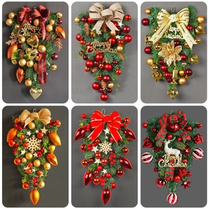 Collection of festive LED Christmas wreaths and door swags with pine cones and bows