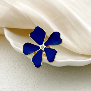 Vintage gold-plated stainless steel open ring with blue enamel flower and center gem
