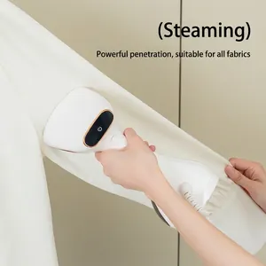 Handheld portable steam iron garment steamer in white and gold for vertical ironing