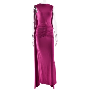 Detail of elegant fuchsia sleeveless dress featuring ruched waist and high side slit
