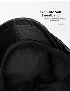 Detail of the soft cotton sweatband inside the premium black PU leather newsboy cap