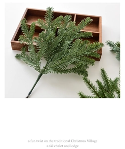 Detailed close-up of realistic dark green artificial pine needles for Christmas decor