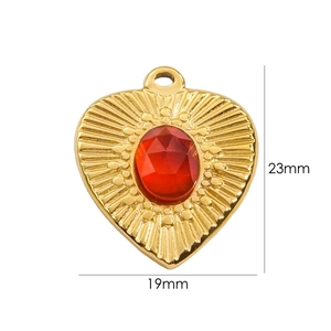 Detailed view of 14K gold-plated heart pendant with red stone, size 23mm by 19mm