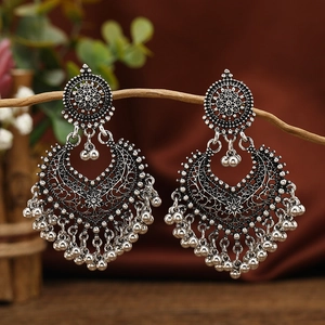 Vintage silver Bohemian filigree heart earrings with bells on a branch display